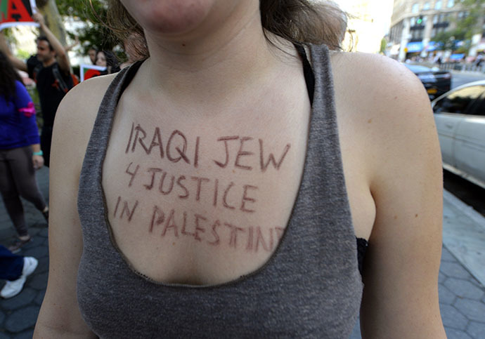 New Yorkers gather to protest IsraelÃs military assault in Gaza during a rally at Foley Square July 24, 2014 where they will read aloud over hundred names of the Palestinian children that killed in IsraelÃs assault, before march through lower Manhattan. (AFP Photo / Timothy A. Clary)