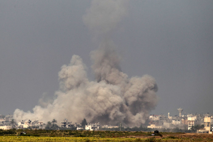 In a picture taken from the Israel-Gaza border, smoke rises from the coastal side of the Gaza Strip following an Israeli controlled explosion of a tunnel, on August 1, 2014 (AFP Photo / Jack Guez)