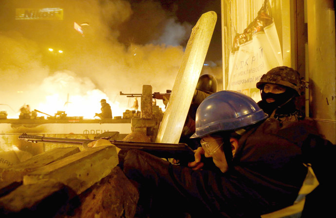 Anti-government protesters aim their weapons during clashes with riot police in Independence Square in Kiev February 18, 2014. (Reuters/Vasily Fedosenko)