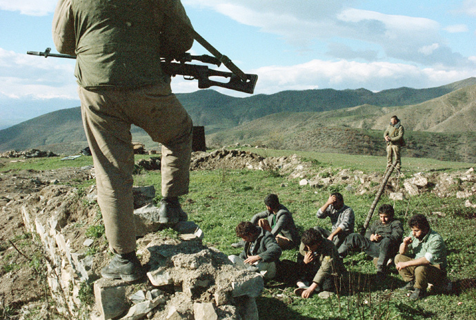 An Azeri soldier guards Armenians detained in the village Spitakesh on June 1, 1989 in Karabakh, Azerbaijan (RIA Novosti / Sergey Titov)
