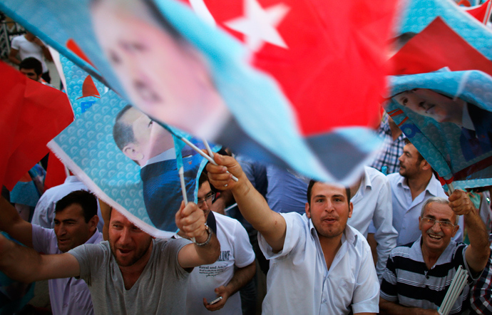Supporters of Turkey's Prime Minister Tayyip Erdogan celebrate his election victory in front of the party headquarters in Ankara August 10, 2014 (Reuters / Umit Bektas)