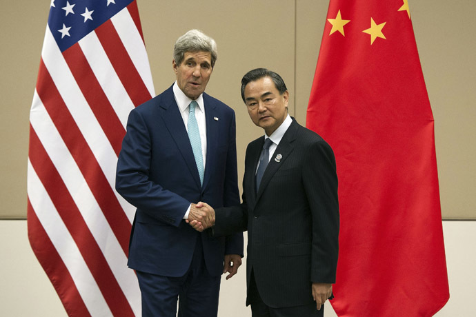 U.S. Secretary of State John Kerry shakes hands with Chinese Foreign Minister Wang Yi during a ASEAN Regional Forum at Myanmar International Convention Centre (MICC) in Naypyitaw August 9, 2014. (Reuters/Nicolas Asfouri)