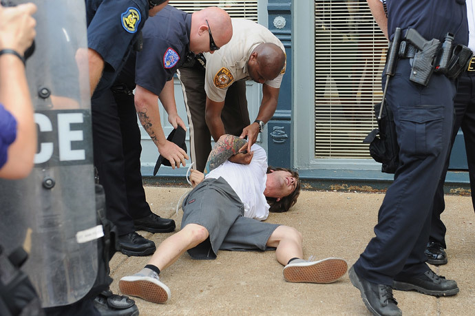 A man is arrested during a protest of the shooting death of 18-year-old Michael Brown outside Ferguson Police Department Headquarters August 11, 2014 in Ferguson, Missouri. (Michael B. Thomas / Getty Images / AFP)