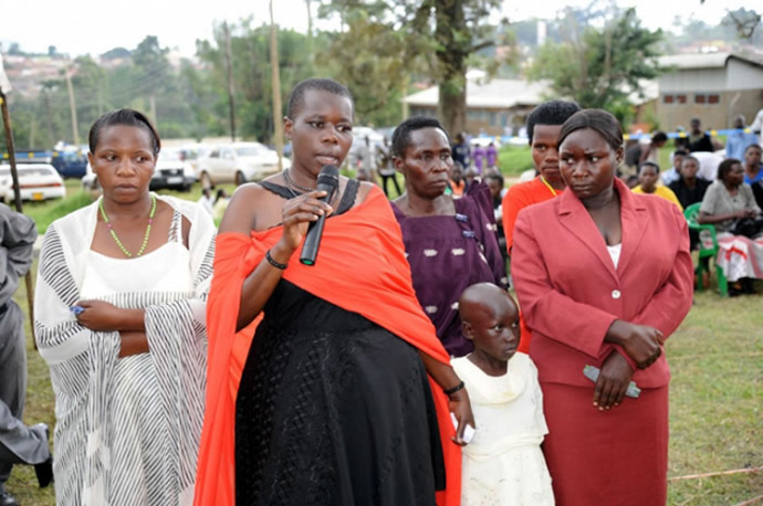 Gloria Tumwijuke (with microphone), Alice Ngonzi Isoke (folding hands in red dress), Diana Alinaitwe (behind Alice), Mrs Isoke (Aliceâs mother), an unidentified health worker(on Gloriaâs right) and a granddaughter to Mrs Isoke â all Ebola survivors narrating their ordeal at Kagaadi Hospital during the function to officially declare Uganda Ebola free (Photo from www.afro.who.int)