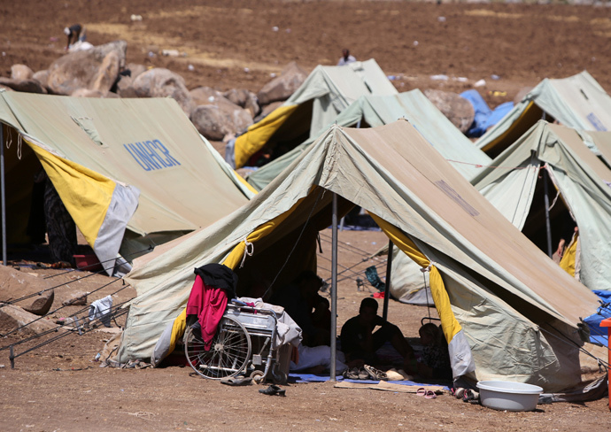 Iraqi Yazidis refugees settle in at Newroz camp in Hasaka province, north eastern Syria after fleeing Islamic State militants in Iraq. (AFP Photo / Ahmad Al-Rubaye)