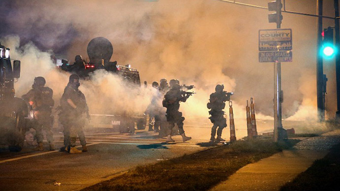 Police attempt to control demonstrators protesting the killing of teenager Michael Brown on August 18, 2014 in Ferguson, Missouri. (AFP Photo / Getty Images / Scott Olson)