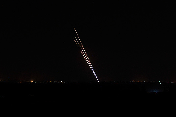 Light trails made by rockets fired from the Gaza Strip mark the night sky from the Israel Gaza Border on August 19,2014. (AFP Photo / David Buimovitch)