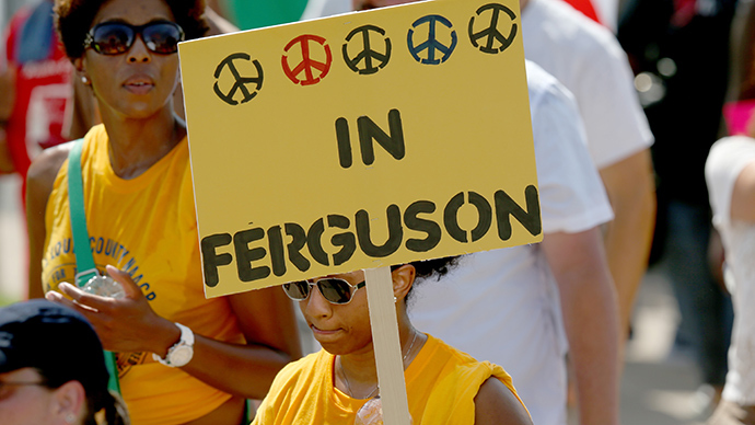 Demonstrators march together to protest the shooting death of Michael Brown on August 23, 2014 in Ferguson, Missouri (AFP Photo / Joe Raedle)