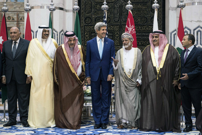 US Secretary of State John Kerry stands amid his counterparts from Egypt, Kuwait, Saudi Arabia, Bahrain and Lebanon during a family photo at King Abdulaziz International Airportâs Royal Terminal in Jeddah September 11, 2014. (Reuters/Brendan Smialowski)