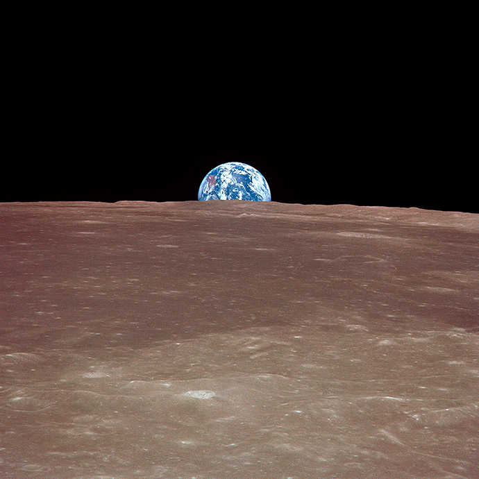 Tthe Earth rising over the limb of the Moon much as the Harvest Moon does from our planetary perspective. (AFP Photo / HO / NASA)