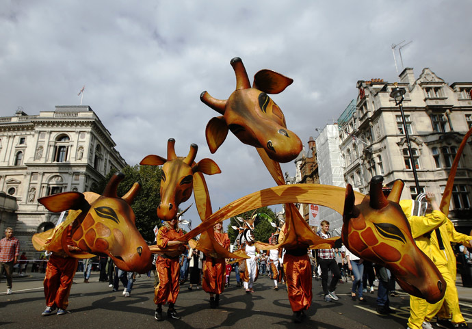 Demonstrators in animal costumes walk in the "People's Climate March" in central London September 21, 2014. (Reuters/Luke MacGregor)