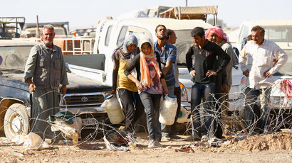 ​'Unite against ISIS!’ Kurds occupy London’s busiest Tube station