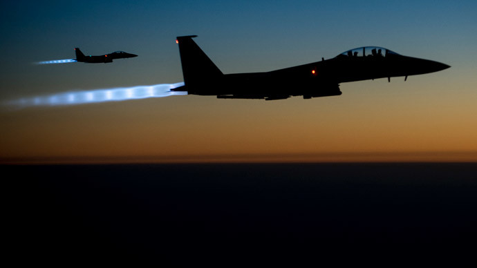 A pair of U.S. Air Force F-15E Strike Eagles fly over northern Iraq after conducting airstrikes in Syria, in this U.S. Air Force handout photo taken early in the morning of September 23, 2014.(Reuters / Airman Matthew Bruch)
