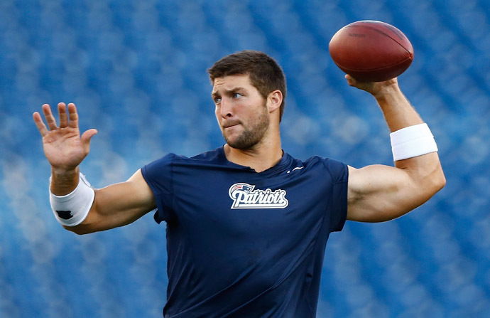Tim Tebow #5 of the New England Patriots warms up prior to the game against the Tampa Bay Buccaneers at Gillette Stadium on August 16, 2013. (AFP Photo/ared Wickerham)