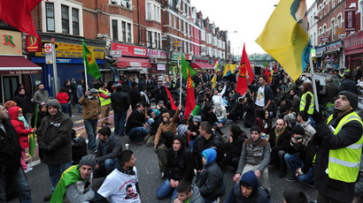 ​'Unite against ISIS!’ Kurds occupy London’s busiest Tube station