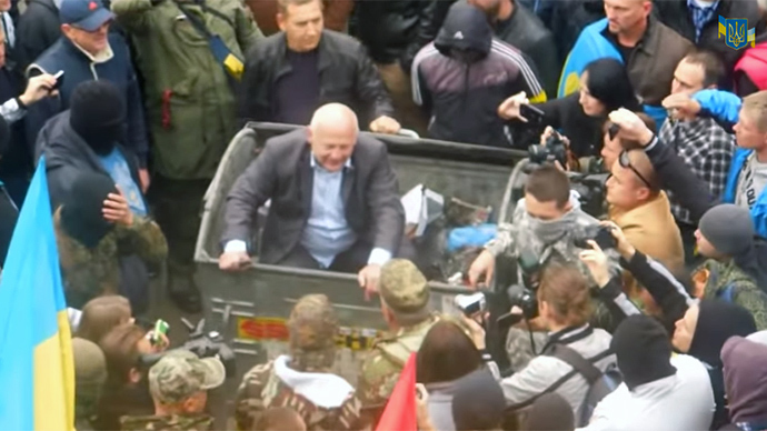 ‘Almost lynching’: Radicals attack Ukrainian officials, throw into trash bins