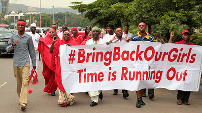Campaigners from "#Bring Back Our Girls" march during a rally calling for the release of the Abuja school girls who were abducted by Boko Haram militants, in Abuja October 17, 2014 (Reuters / Afolabi Sotunde)