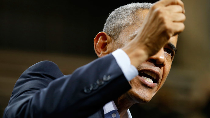 Obama hits campaign trail, audience heckles, leaves early