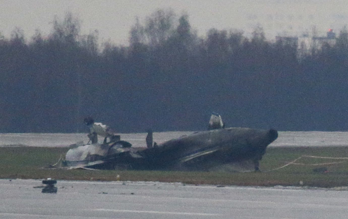 The wreckage of what is believed to be Christophe de Margerie's Dassault Falcon jet is seen at Moscow's Vnukovo airport, October 21, 2014. (Reuters/Maxim Zmeyev)