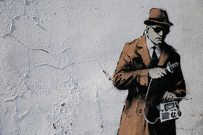 A graffiti art is seen on a wall near the headquarters of Britain's eavesdropping agency, Government Communications Headquarters, known as GCHQ, in Cheltenham, western England (Reuters / Eddie Keogh)