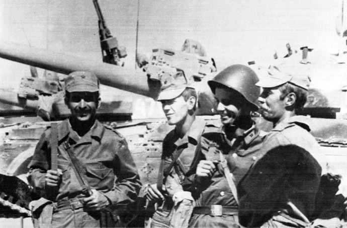 Soviet soldiers stand in front of their tanks as they take one final look at local scenery, according to Soviet news agency Tass who released this picture October 15, 1986. Six Soviet regiments are said to be returning from Afghanistan to their permanent bases in the Soviet Union. (Reuters/TASS)