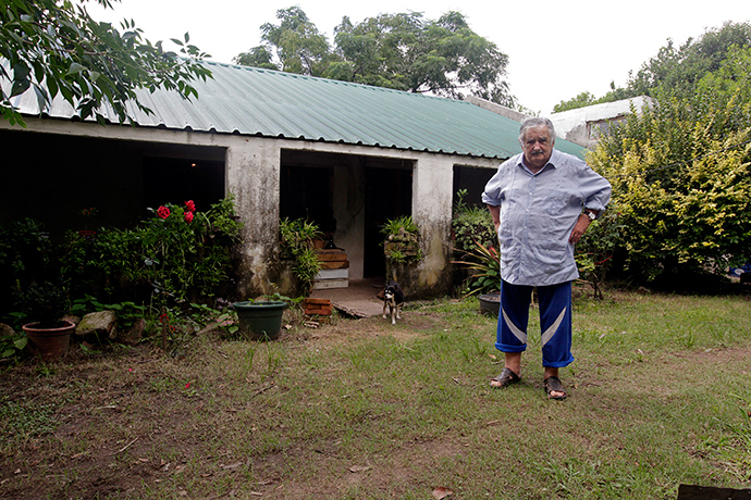 Uruguay's President Jose Mujica poses for a picture in front of his farmhouse following an interview with Reuters, on the outskirts of Montevideo (Reuters / Andres Stapff)