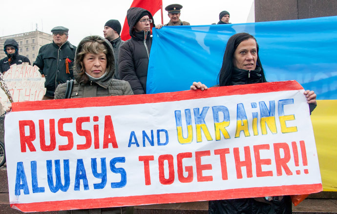 Pro-Russian protesters hold a placard reading as they take part in a pro-Russian rally in the eastern Ukrainian city of Kharkiv on April 13, 2014. (AFP Photo / Sergey Bobok)