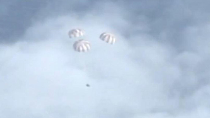 Orion spacecraft splashes down after historic double-orbit mission