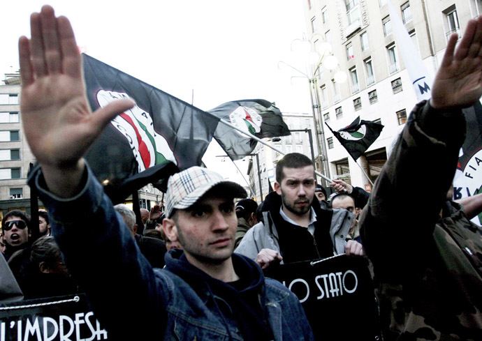Supporters salute during a demonstration by the extreme right group "Fiamma Tricolore" (Tricolour flame) in central Milan. (Reuters/Loris Savino)