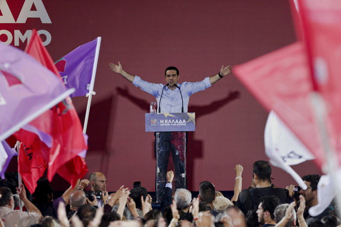 Leader of leftist main opposition Syriza party and candidate for the European Commission presidency Alexis Tsipras waves at party supporters during a pre-election campaign rally in Athens. (Reuters/Alkis Konstantinidis)