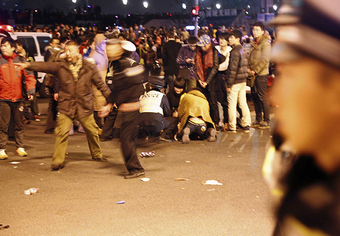 Police control the site after a stampede occurred during a New Year's celebration on the Bund, a waterfront area in central Shanghai, January 1, 2015. (Reuters/Stringer)