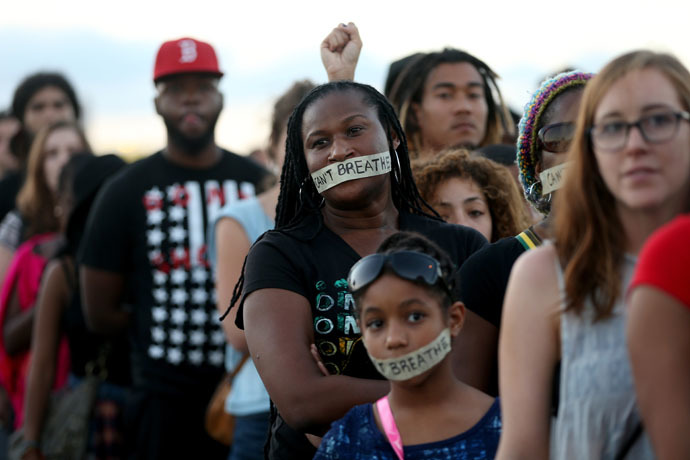 Demonstrators stand with tape reading, " I Can't Breathe", as they march along Interstate 195 after police shut the road down to protest police abuse on December 7, 2014 in Miami, Florida. (Joe Raedle/Getty Images/AFP)