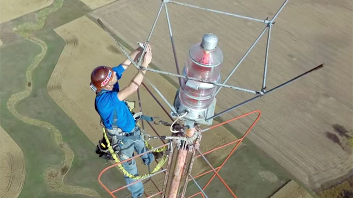 Stunning drone footage shows man changing light bulb at ...