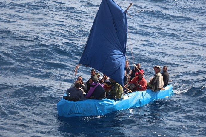 Cuban migrants sail a rustic vessel south of Key West, Florida, Jan. 1, 2015. The 24 were later repatriated to Bahia de Cabañas, Cuba (US Coast Guard)