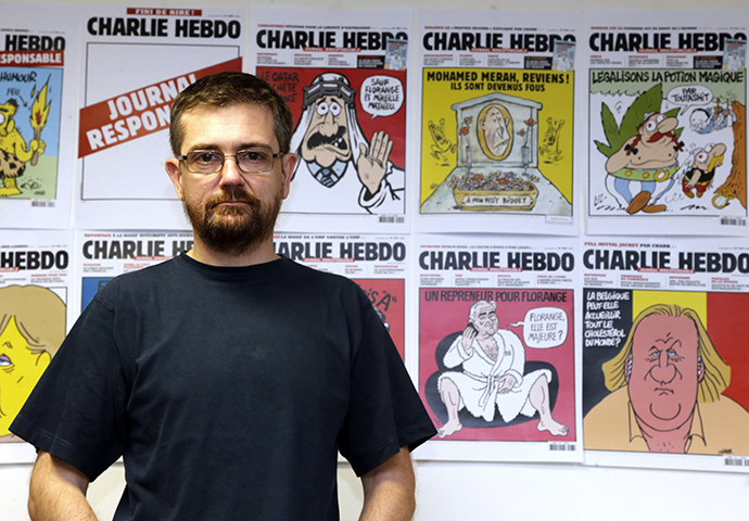 French satirical weekly Charlie Hebdo's publisher, known only as Charb, poses as he presents his new comic strip named "La Vie de Mahomet" (The life of Mohammed) in Paris on December 27, 2012 (AFP Photo)