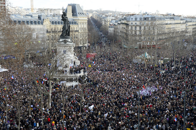 People gather on the Place de la Republique (Republic Square) in Paris before the start of a Unity rally âMarche Republicaineâ on January 11, 2015 in tribute to the 17 victims of a three-day killing spree by homegrown Islamists. (AFP Photo / Bertrand Guay)
