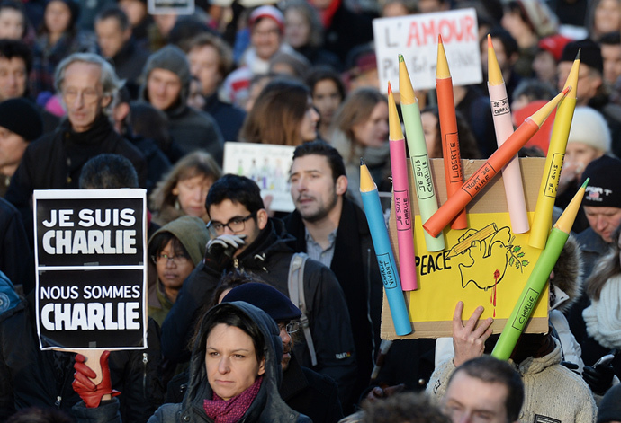 A man holds a placard reading "Je suis Charlie" (I am Charlie) during a Unity rally âMarche Republicaineâ on January 11, 2015 in Strasbourg, eastern France, in tribute to the 17 victims of the three-day killing spree. (AFP Photo / Patrick Hertzog)