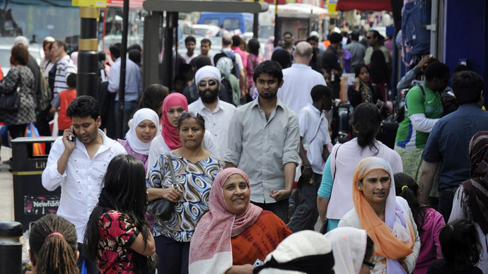 Shoppers walk in a market in the Upton Park neighborhood in east London (Reuters / Paul Hackett)