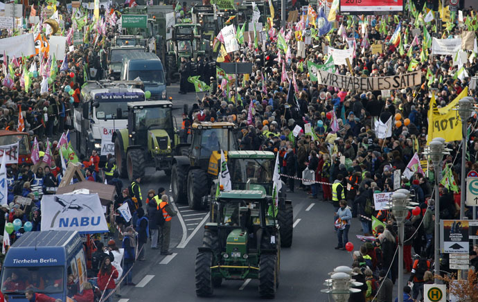 Tractors take part in protest of German farmers and consumer rights activists against the Transatlantic Trade and Investment Partnership (TTIP), mass husbandry and genetic engineering in Berlin, January 17, 2015. (Reuters/Fabrizio Bensch)
