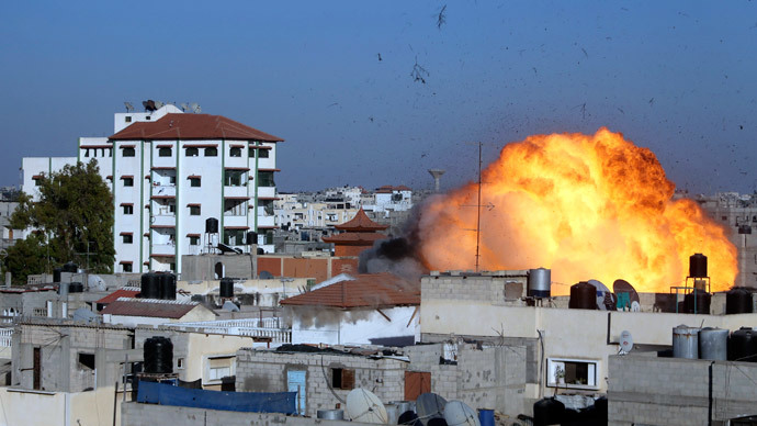 Flames are seen during what witnesses said was an Israeli air strike that targeted the house of Palestinian senior Islamic Jihad leader Nafez Azzam in Rafah, in the southern Gaza Strip August 26, 2014. (Reuters / Ibraheem Abu Mustafa)