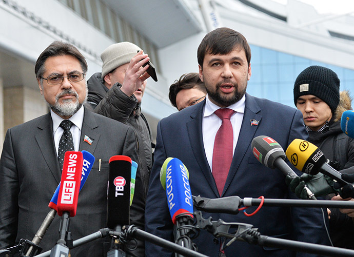 Representatives of the Donetsk and Lugansk People's Republics Denis Pushilin (R) and Vladislav Deinego answer journalists' questions at Minsk Airport, January 30, 2015. (RIA Novosti/Viktor Tolochko)