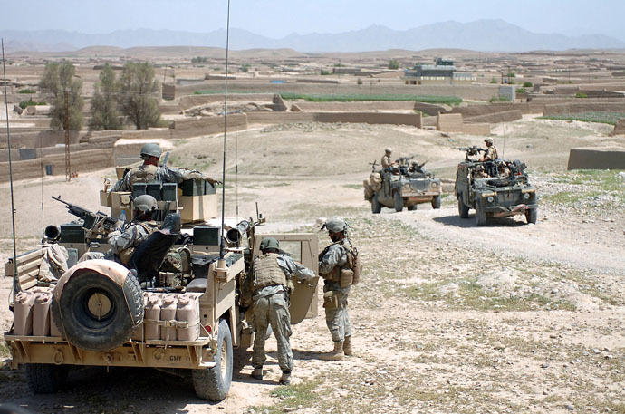 American and British soldiers take a tactical pause during a combat patrol in the Sangin District area of Helmand Province in 2007. (Photo from Wikipedia.org)
