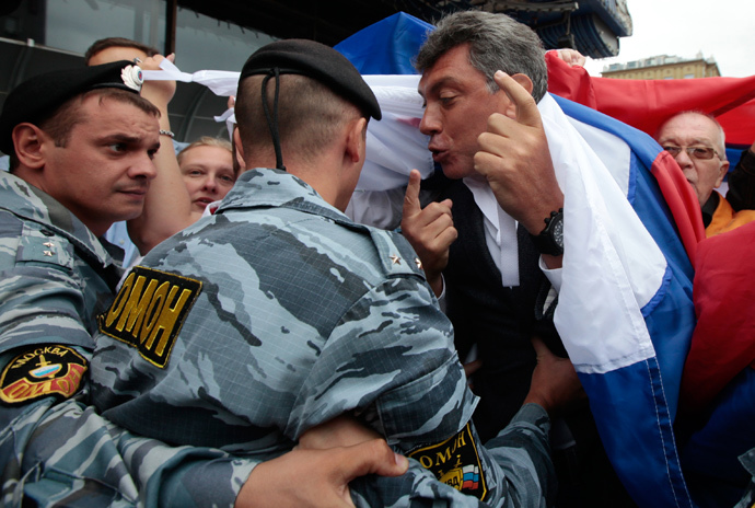 OMON police officers prevent participants from attending a rally staged on Moscow's Novy Arbat Street to commemorate August 1991 coup attempt. Foreground right: Solidarity movement leader Boris Nemtsov, 2010 (RIA Novosti / Ruslan Krivobok)