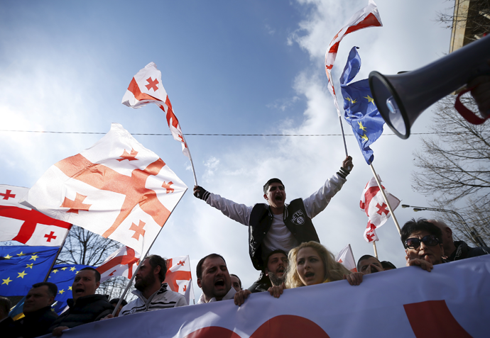 Opposition supporters march on the street during a rally organised by the United National Movement, calling for the resignation of the government in Tbilisi, March 21, 2015. (Reuters / David Mdzinarishvili)