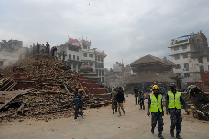 Nepalese rescue workers and onlookers gather at Kathmandu's Durbar Square, a UNESCO World Heritage Site that was severely damaged by an earthquake on April 25, 2015. (AFP Photo/Prakash Mathema)