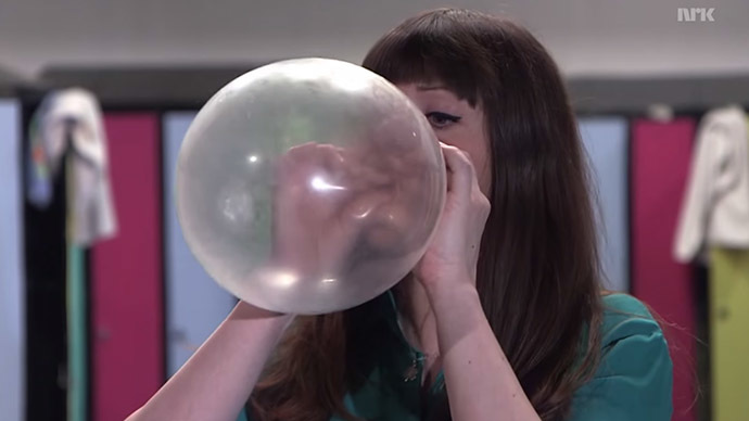 Illuminating the properties of condoms (Still from Youtube video.)