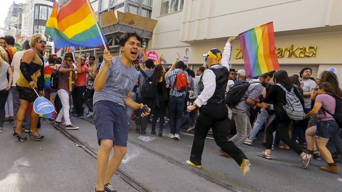 LGBT rights activists run as riot police use a water cannon to disperse them before a Gay Pride Parade in central Istanbul, Turkey, June 28, 2015.(Reuters / Huseyin Aldemir)