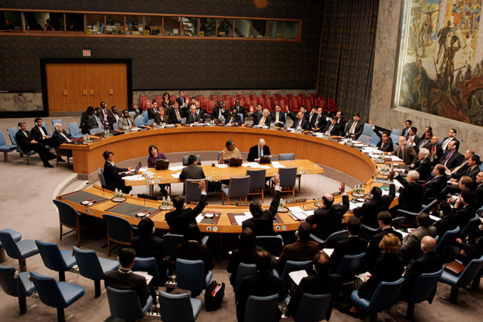 Members of the U.N. Security Council raise their hands during a unanimous vote on a resolution authorizing trade sanctions against Iran for its nuclear program at the United Nations headquarters in New York December 23, 2006 (Reuters)