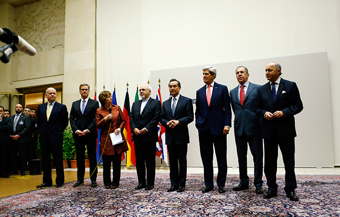European Union foreign policy chief Catherine Ashton (3rd L) delivers a statement during a ceremony next to British Foreign Secretary William Hague, Germany's Foreign Minister Guido Westerwelle, Iranian Foreign Minister Mohammad Javad Zarif, Chinese Foreign Minister Wang Yi, U.S. Secretary of State John Kerry, Russia's Foreign Minister Sergei Lavrov and French Foreign Minister Laurent Fabius (L-R) at the United Nations in Geneva November 24, 2013 (Reuters / Denis Balibouse)