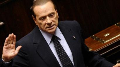 Berlusconi feels 'obliged' to stay in politics despite fraud conviction